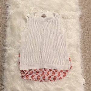 Sleeveless sweater with paisley blouse